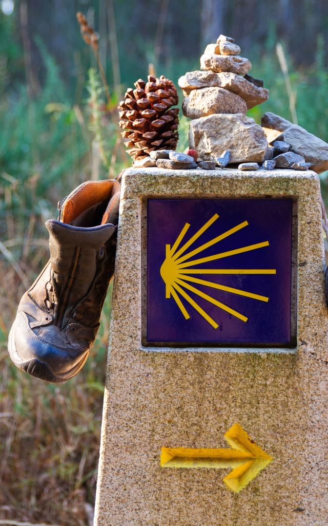 Hiking boots on the stone signal