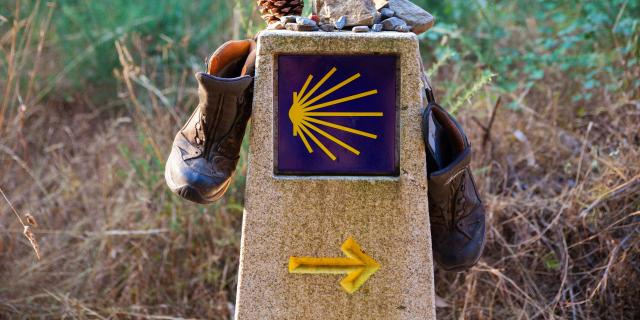 Hiking boots on the stone signal