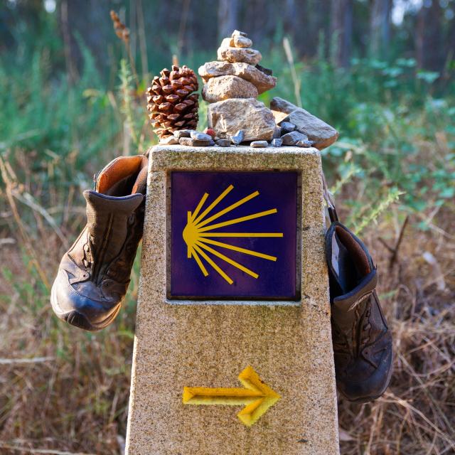 Hiking boots on the stone signal